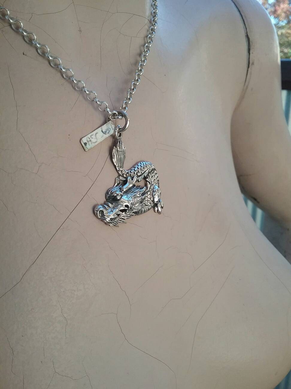 mythical dragon pendant . sterling silver.