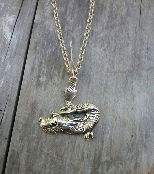 mythical dragon pendant . sterling silver.