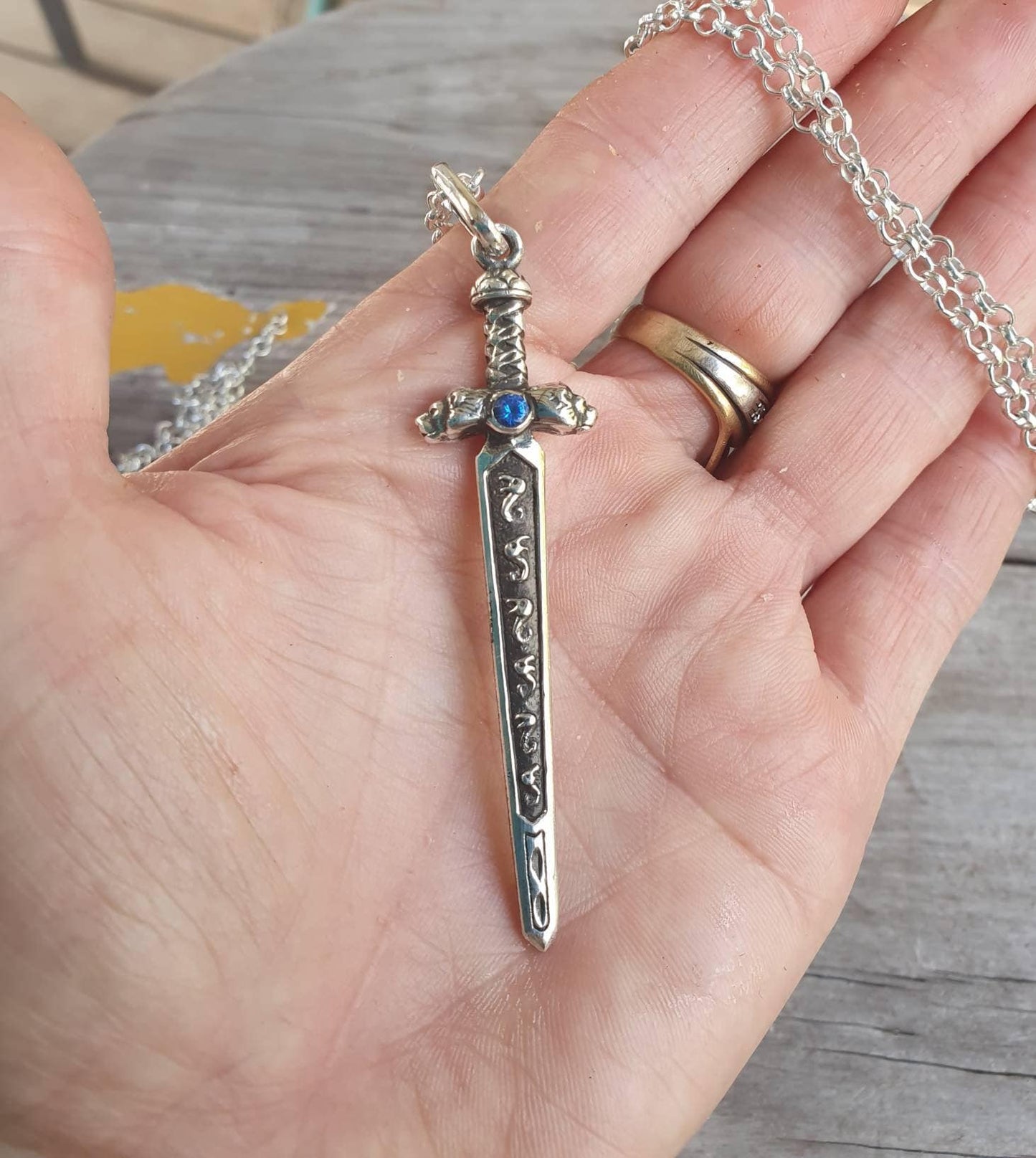 sword pendant,sterling silver pendant,beautifully  detailed with lions heads,medieval long pendant.