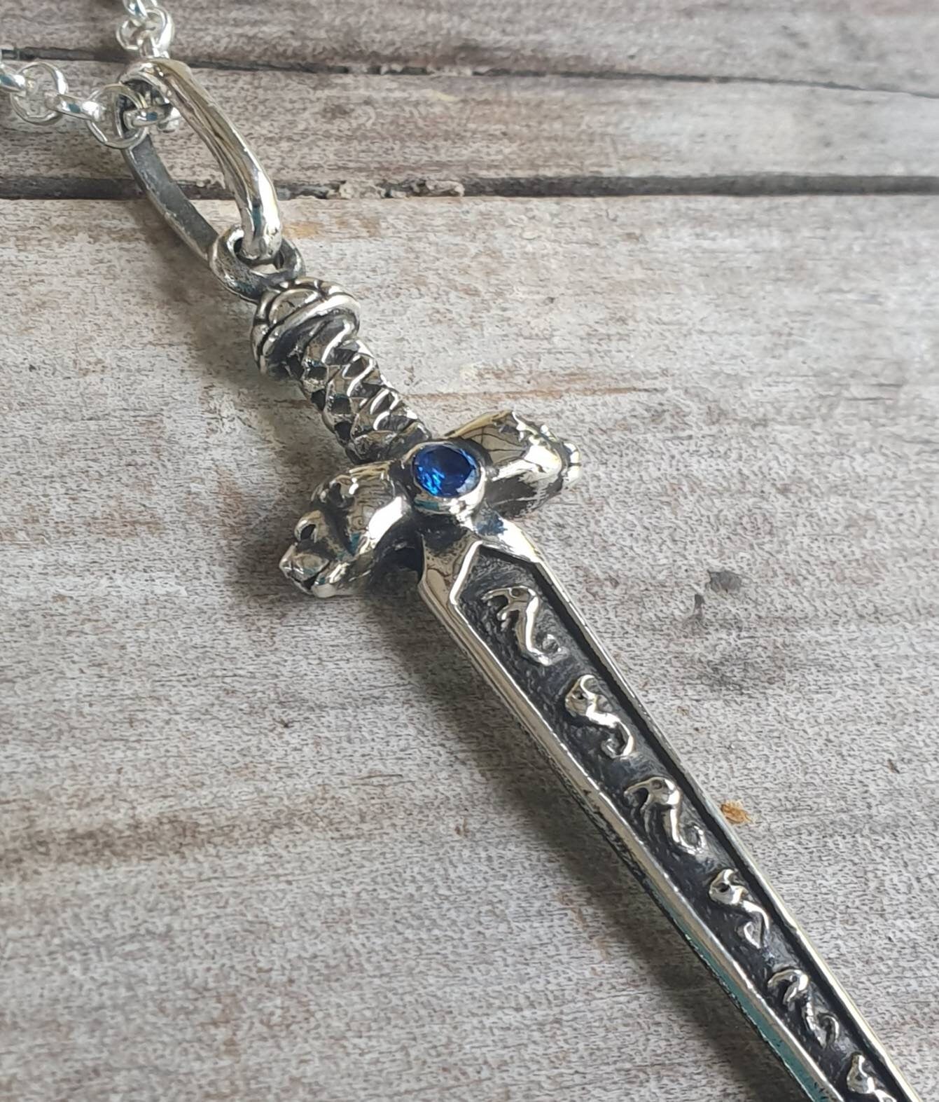 sword pendant,sterling silver pendant,beautifully  detailed with lions heads,medieval long pendant.